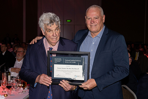 The Hon Ron Boswell receives his Hall of Fame certificate from SIA Chair Clayton Nelson.