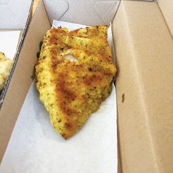 Photo of crumbed Nannygai in a box