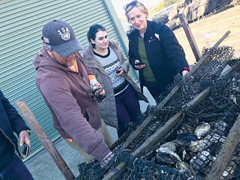 Photo of Oyster grower Justin Goc with  Donna Forlin and Ros Harvey from The Yield at Barilla Bay Oysters, Tasmania. 