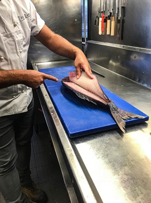 Photo of fish being dry-filleted