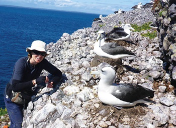 Photo of Julie McInnes with albatross