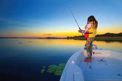 Photo of young girl fishing