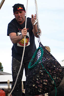 Photo of Bryan Denny with a catch of Periwinkles