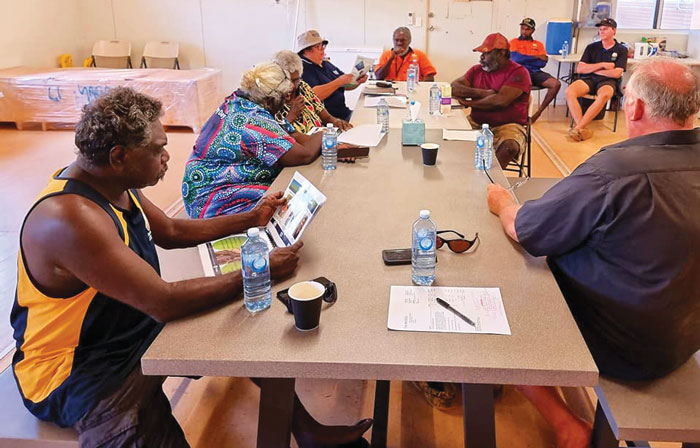 Photo of Cynthia Coyne presenting information to Yagbani Aboriginal Corporation Directors and aquaculture staff in Warrawi community.