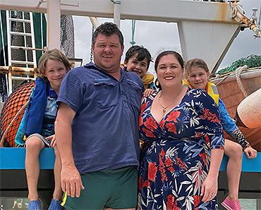 Queensland fisher Kylie Dunstan (front, right) with her family: (back, from left) children Lachlan, William and Chloe; and (front left) brother Shane Paulsen, co-owner of Paulsen Fisheries Pty Ltd and skipper of the FV Angelina S. Photo: Supplied
